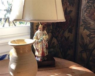 Small olive jar by Doug Bratcher, Chinese porcelain figural lamp, antique leather screen Painted in floral motif