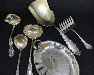 An extensive offering of Sterling silver; shown a Gorham Luxembourg Cracker Scoop, a Sardine Server, Sauce Ladles, and a Leaf Dish 