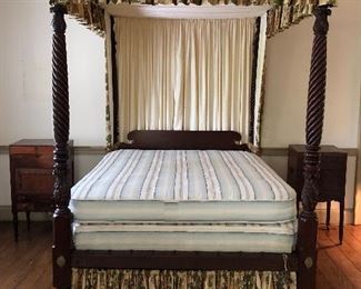 Antique 19th century American Classiscal Revival four post bed with tester.  The beautifully carved posts feature a twisted rope design and tobacco leaf motif.