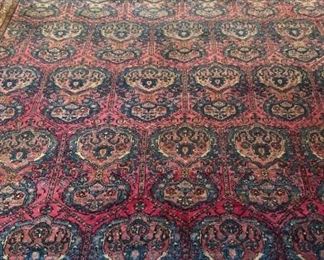 11’2” by 16’7” Antique early 20th century Persian hand knitted wool rug 