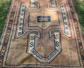 5’ by 7’6” vintage hand knotted wool on wool rug 