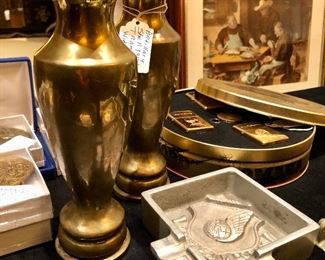 Gentleman’s corner; WW2 era tramp art, western belt buckles, vintage lighters, sterling topped scent bottles, marble valet tray