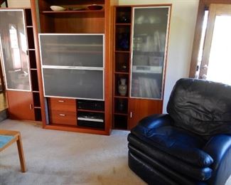 VERY COMFORTABLE HANCOCK AND MOORE BLUE LEATHER RECLINER  $600.                                                                     ENTERTAINMENT CENTER SOLD 
