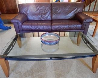 PLUM LEATHER SOFA $600                                                       GLASS TOP COFFEE TABLE SOLD