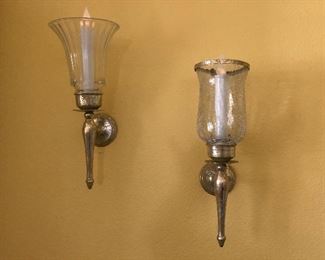 Two of several wall sconces