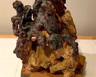 This is a Stupendous Terra-cotta Sculpture with oxide finish  by Margarate Fuller - The knight and horses riding this particular piece has the front pew very large with a horse head +  several smaller horse heads with the knight riding on one.  Amazing!