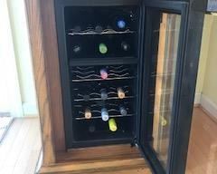 Wine refrigerator built into cabinet