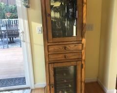 Wine cabinet with built in refrigerator.  Keeps 6 bottles cold and stores 12 additional bottles