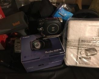 Speed Gun, Video Camera (with case and brand new DVDs), Canon Camera with case, Sentry portable Safe, Electric outlet adapter for car 