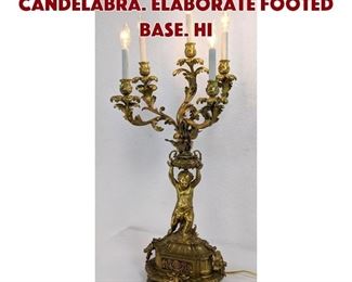 Lot 284 Cherub Form 5 Arm Candelabra. Elaborate footed base. Hi