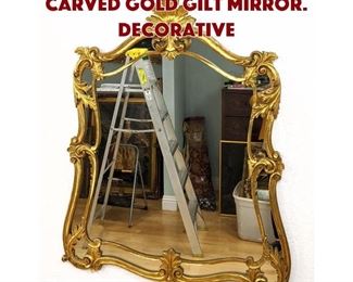 Lot 578 Ornate Shield Shape Carved Gold Gilt Mirror. Decorative