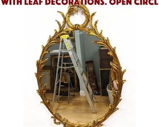 Lot 589 Gold Gilt Oval Mirror with Leaf Decorations. Open circl