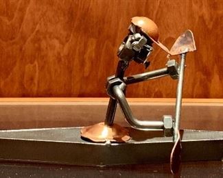 Item 137: Metal Bolt Sculpture of Man in Kayak - 9.25" x 4": $25