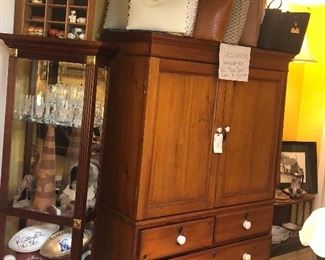 Antique pine cabinet from England, new leather handbags on top