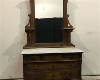 Lot 44
antique Victorian chest of drawers on metal casters with mirror and marble top