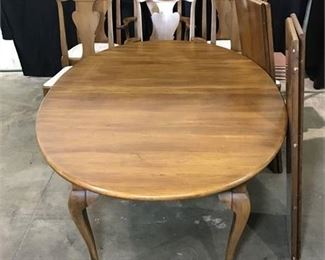 Lot 42
cherry wood dining room table with six chairs, four leaves and pads
