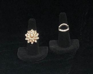 Ladies 14KT yellow gold diamond cluster ring. Appraised 10-31-2020.  Half carat round center diamond. Total approximate combined diamond weight is 4.40 carats.   Ladies ring guards. One is 14 KT white gold with a total combined diamond weight of .24 carats. One is platinum with a total combined diamond weight of .31 carats.  Ring guards will be sold as a set only. 