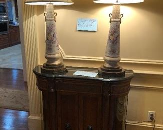 cabinet with marble top and vintage lamps