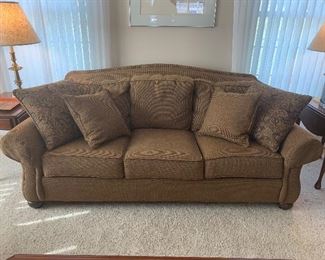 Ethan Allen sofa with back cushions and throw pillows.