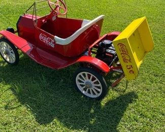 Model T Shiners style car with tilt wood bed over top of motor. In original condition but motor has been gone through and runs great and the tire tubes have been replaced. Originally owned by the Greenville, NC Coke plant in the 80s and was used in parades and our collector obtained it when they stopped using it sometime later. Awesome piece to add to or start a collection.