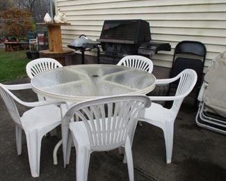 gas grill & plastic table & chairs