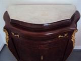 Serpentine front console chest 2 doors under 1 drawer, white marble top with applied ormolu.