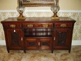 Walnut buffet with carved floral panels, circa 1890.