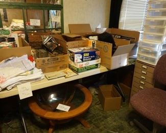 office supplies, videos, cds, table cloths, round coffee table