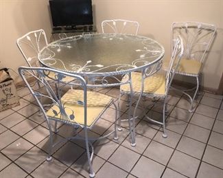 Glass/metal table with 5 chairs....