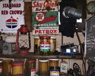 Vintage signs, license plates and oil cans.