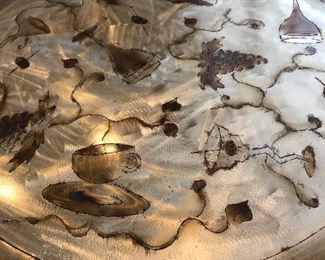 gorgeous detail of the metal hand etched table