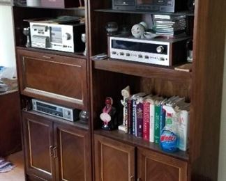 2 - Wood Cabinets with shelves, Closed Cabinet at the base and one unit had a cabinet in middle that can be used as a bar - Can be used for an entertainment center, decorative items, books and more - $50 each - Total of $100.