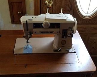 1950's SINGER 401a Slant 7 Sewing Machine in a Mid-Century Cabinet and chair - There additional feet, button hole attachment and metal bobbins -$450