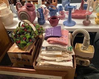 Niloak in background, embroidered & crochet scarves, vacuum