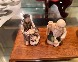 #112 - Ivory Netsuke Women w/Child & Fish    $125  signed #113 - Ivory Netsuke with cup and drinking vessel   			 $125 signed 

