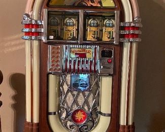 Wall mounted Wurlitzer Princess CD Jukebox.  Perfect condition! Loaded and ready to play.