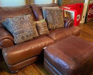 Perfect for your man cave, too!  Leather love seat sofa and matching ottoman.