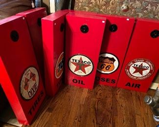 Home made wooden display boxes with gasoline signage.