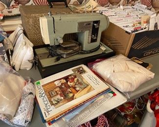 Classic Kenmore sewing machine in case. Hundreds of patterns and craft books!