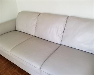As new gray leather sofa
