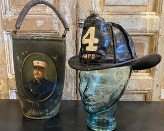 Sold as a pair - from the estate of Chief Howard L. Stanton, South Manchester Fire Department # 4 high eagle fireman’s leather John Olson Co helmet and leather fire bucket with Stanton’s painted portrait on one side and D. Lathrop No 1 on the reverse.