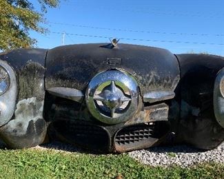 Vintage 1950 Studebaker Bullet Nose Automobile front clip with fenders, hood, front valence, nose and hood emblems, lights and bezels
