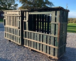 2 Antique farmhouse portable wood slat corn crib storage cabinets, old green paint, drop down door on each, castors.