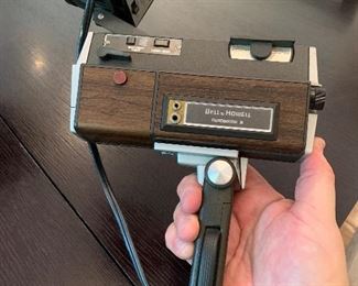 Vintage Bell and Howell movie camera with light