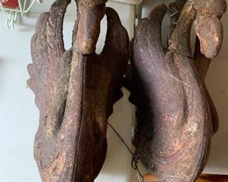 Large rusted cast iron griffins