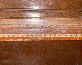 Leather-covered speakeasy piano.  Only 44 inches wide, 40 inches high, 22 inches deep from front to back.  The keyboard is 36 inches across.  It is needs much work.  