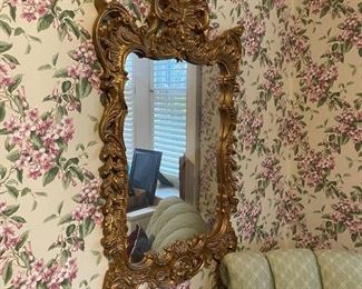 Ornate gilt framed mirror