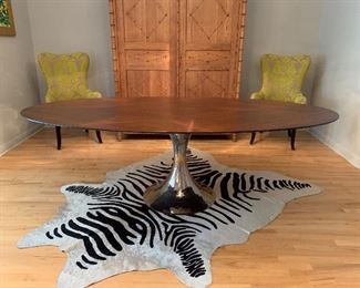 This Stunning Julian Chichester Dakota Table is sure to be a show stopper! This base is hand beaten making it unique in appearance. The top is Firmdale Oak paired with Polish Nickel base. Measures: 95x48x30 Retails for $10,500 Yours for $7,000: Also pictured - $200 Faux Zebra Hide Measures: 6x8. DETAILS AND PRICING OF ADDITIONAL ITEMS SEEN HERE IN LATER PICS. KEEP SCROLLING! :)