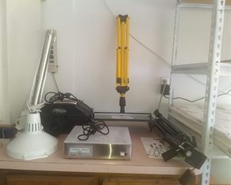 Sold -Art-o-Graph with optional Tripod Stand, Tripod, Artist Lamp that also has an optional stand. Small Artist Light Table, Metal Shelving and Cabinets. Full Sheets of ARCHES Watercolor Paper.