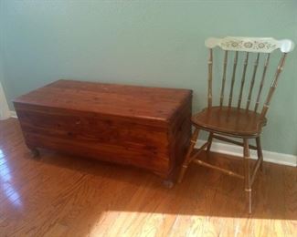 Cedar Chest and Chair with painted design on the back.